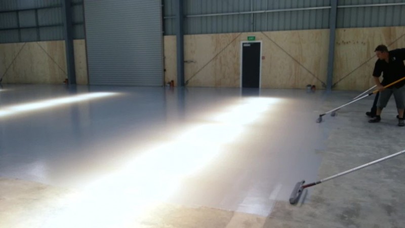 APCO Coatings Pitakote Epoxy: Concrete Grey - being applied to a warehouse floor
