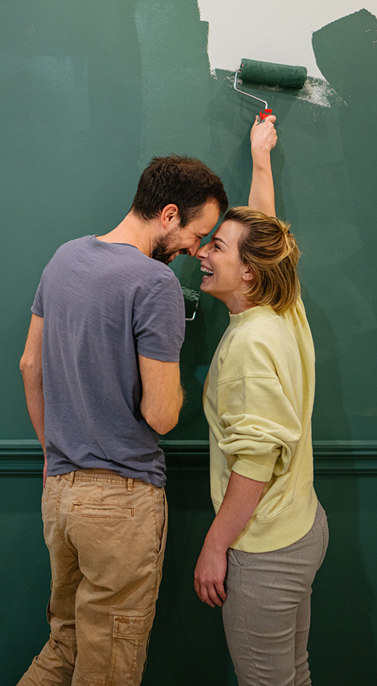 PPG Paints being applied by a man and woman